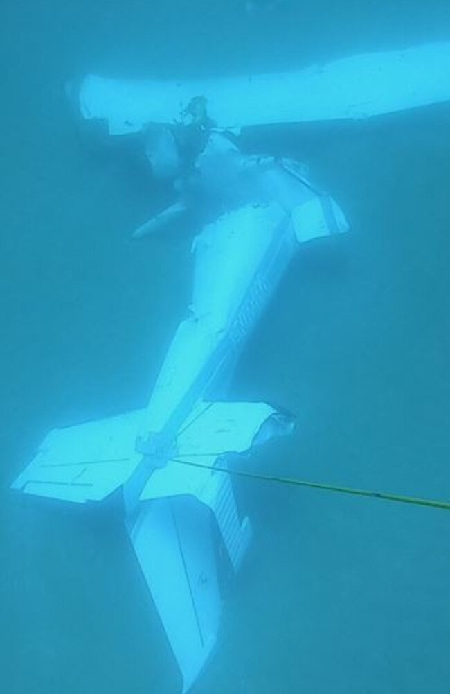 A weight, rope and buoy had been attached to the aircraft tail by the divers. Picture: Queensland Police Service