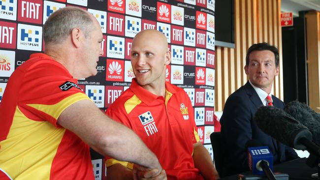 The Gold Coast Suns confirming Gary Ablett’s three-year contract extension. Ablett (middle) pictured with then coach Rodney Eade (left) and former CEO Andrew Travis. Picture: Richard Gosling