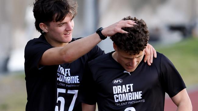 Archie Roberts (left) with Tarkyn O’Leary after the 2km time-trial. Picture: Dylan Burns/AFL Photos via Getty Images