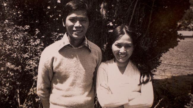 Hieu Van Le and Lan Le wife holding a photograph of himself with his wife Lan Le when they arrived in Australia in 1977 at his Burnside home.