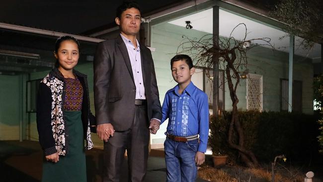 Anwar Karimi with Shakila, 10, and Hadi, 9, at their new home in Sydney last night. Picture: James Croucher