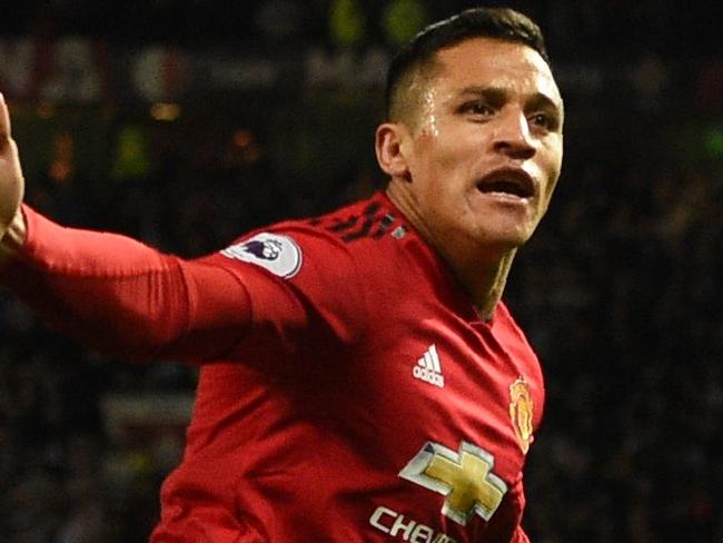 Manchester United's Chilean striker Alexis Sanchez celebrates after scoring the team's third goal during the English Premier League football match between Manchester United and Newcastle at Old Trafford in Manchester, north west England, on October 6, 2018. (Photo by Oli SCARFF / AFP) / RESTRICTED TO EDITORIAL USE. No use with unauthorized audio, video, data, fixture lists, club/league logos or 'live' services. Online in-match use limited to 120 images. An additional 40 images may be used in extra time. No video emulation. Social media in-match use limited to 120 images. An additional 40 images may be used in extra time. No use in betting publications, games or single club/league/player publications. /