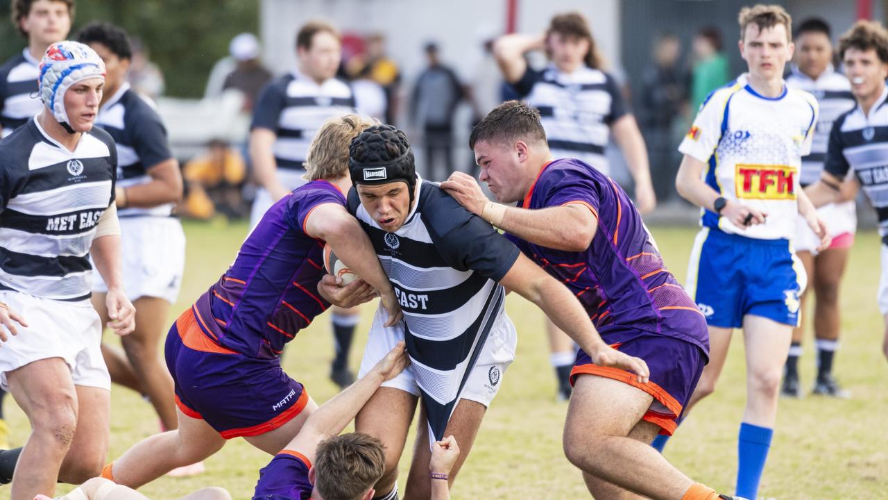 Ben Davis of Met East pushes through the Sunshine Coast defence.