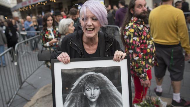 Fans arrive at the Hammersmith Apollo ahead of the second live performance by the singer Kate Bush in 35 years on August 27, 2014 in London, England.