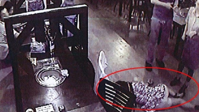 The woman topples from her chair on to the floor of the restaurant. Picture: Picture: AAP/Supplied by Liquor and Gaming