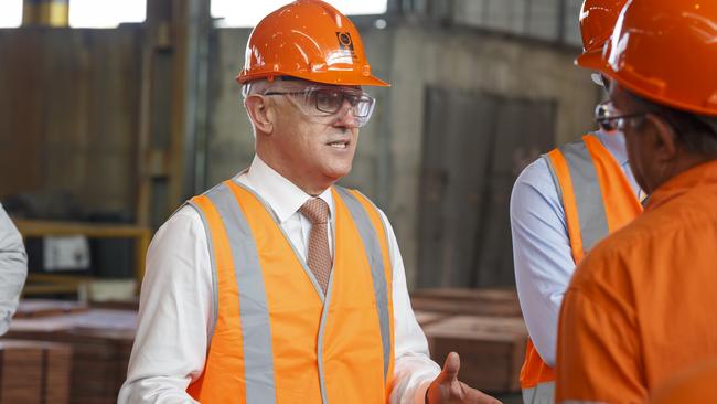 Prime Minister Malcolm Turnbull with workers during a visit to Glencore copper refinery in Townsville. Picture: AAP/Andrew Rankin