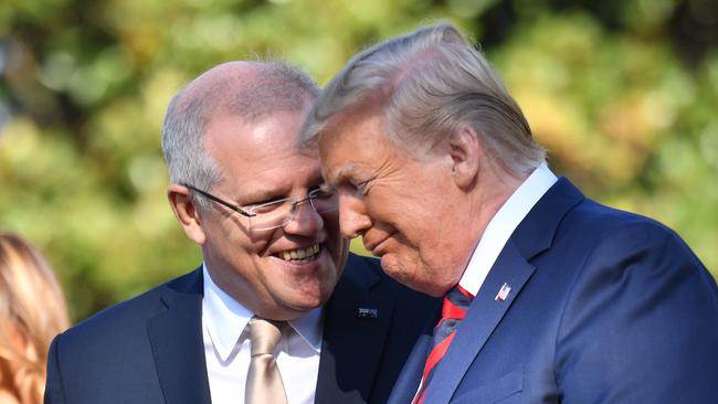 Then-US President Donald Trump shares a moment with Scott Morrison at a ceremonial welcome on the south lawn of the White House in Washington DC in 2019.