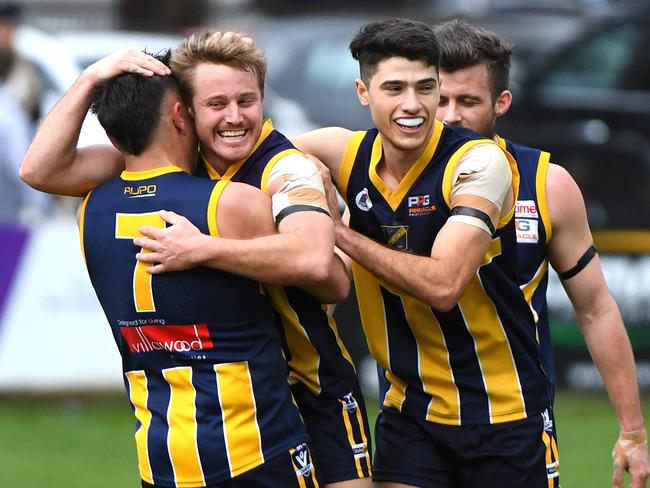 Kayne Murphy (centre left) of Rubertswood reacts after kicking a goal during the RDFL grand final, Sunbury, Sunday, September 15, 2019. RDFL footy grand final: Rupertswood v Wallan. (AAP Image/James Ross) NO ARCHIVING