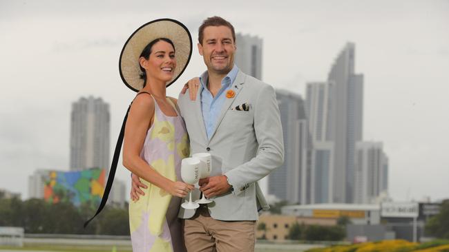 Clare and Dan Anstey, dressed in French Riviera themed raceday attire, overlooking the track at the Gold coast Turf Club. Picture: Glenn Hampson