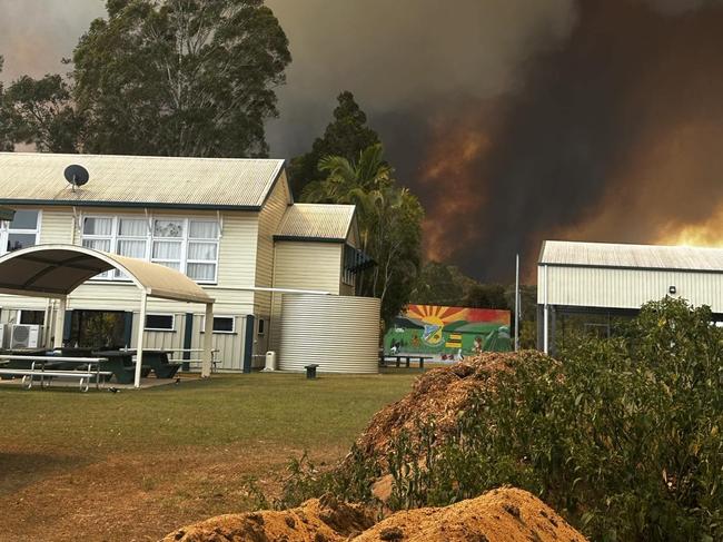 Goodwood State School teacher Teresa Fitch shared this image of the flames approaching the school, moments before they were evacuated.