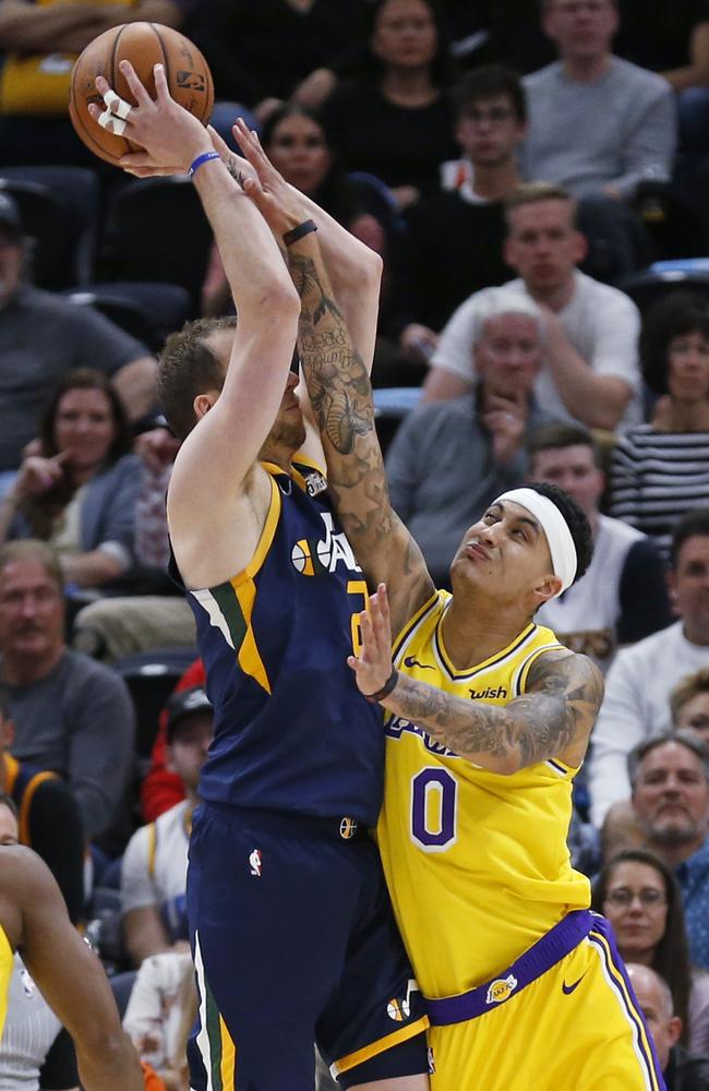 Joe Ingles battles Lakers forward Kyle Kuzma during the win. Picture: AP