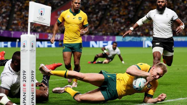 Reece Hodge dives over to score against Fiji. Picture: Getty Images