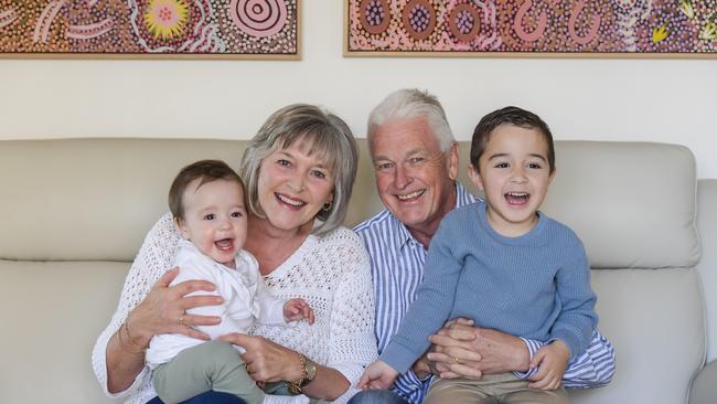 Gary and Robyn with their grandkids, Archie, nine months, and Reggie, 4. Picture: RoyVPhotography