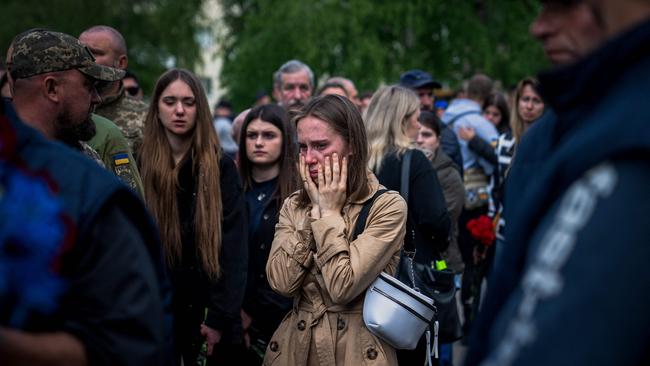 A woman is overcome with grief during the funeral of Ukrainian serviceman Valerii Sosnovskii who died near Bakhmut. Picture: AFP