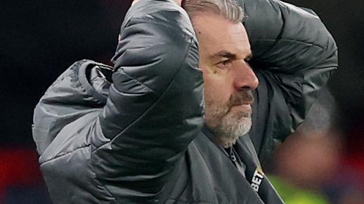 LIVERPOOL, ENGLAND - FEBRUARY 06: Ange Postecoglou, Manager of Tottenham Hotspur, reacts as Arne Slot, Manger of Liverpool, watches on during the Carabao Cup Semi Final Second Leg match between Liverpool and Tottenham Hotspur at Anfield on February 06, 2025 in Liverpool, England. (Photo by Carl Recine/Getty Images)