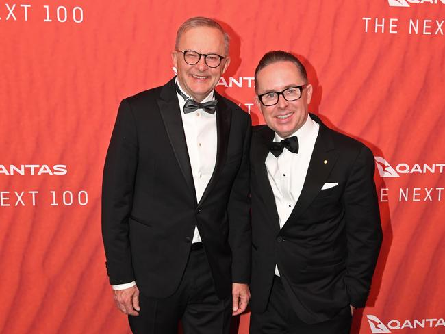 SYDNEY, AUSTRALIA - MARCH 31: Australian Prime Minister Anthony Albanese (L) stands with Qantas CEO Alan Joyce as they attend the Qantas 100th Gala Dinner at Jetbase 96 hangar at Sydney's International Airport on March 31, 2023 in Sydney, Australia. (Photo by James D. Morgan/Getty Images)