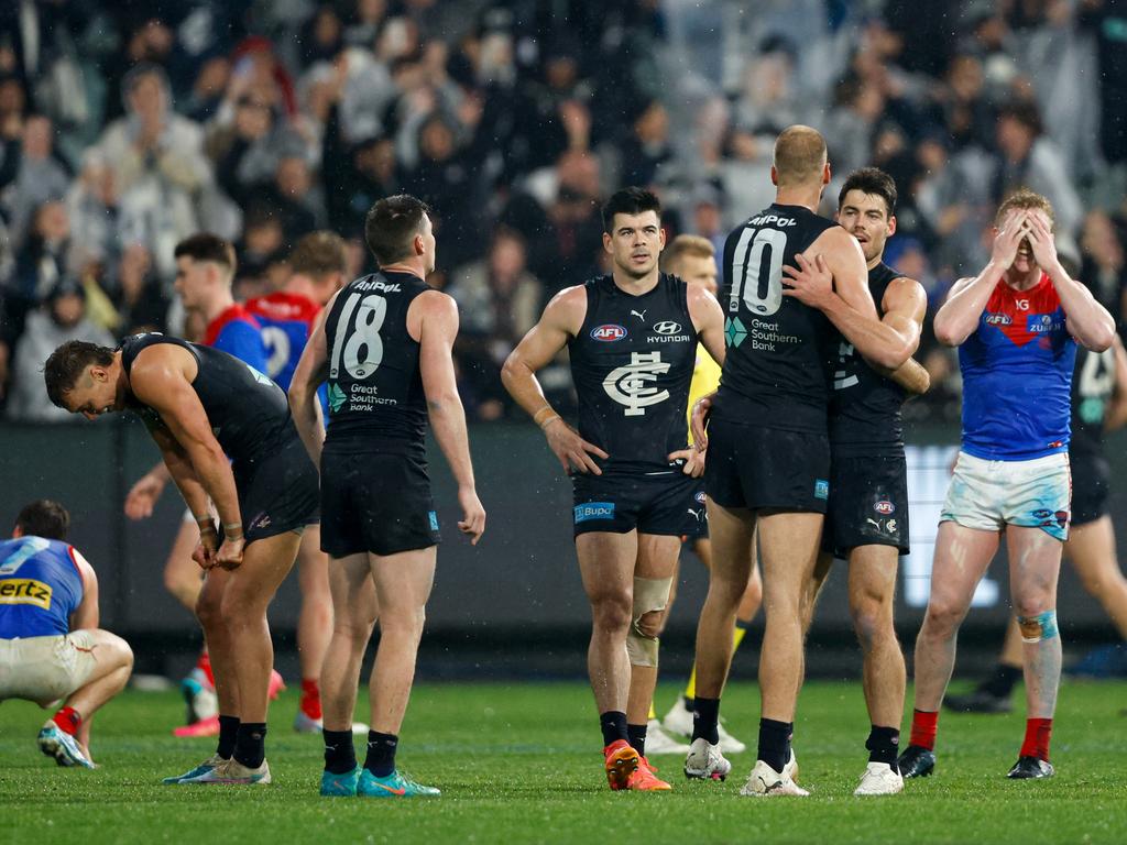 Relieved Carlton players on the final siren. Picture: Dylan Burns/AFL Photos