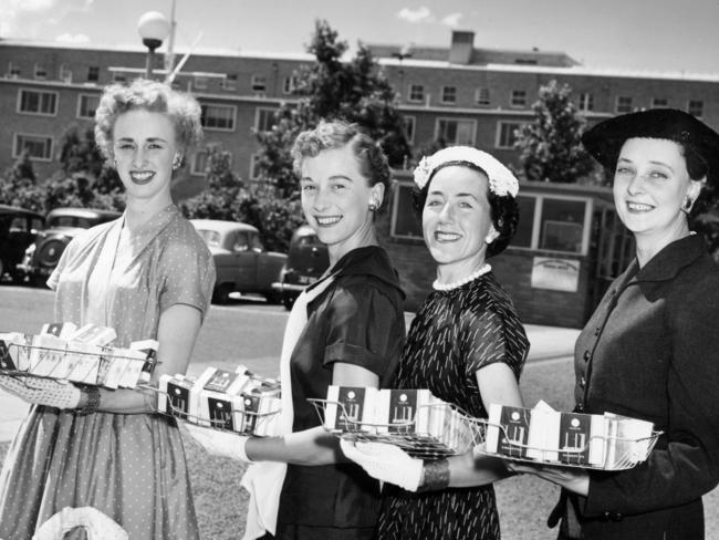 Helpers at Heidelberg Military Hospital to distribute cigarettes to repatriation patients for Christmas in 1955.