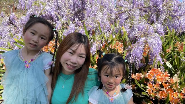 Sandy Tran with her daughters Clarissa Choy, 6, and Sophia Choy, 3, at the Wistaria Gardens in Parramatta Park.