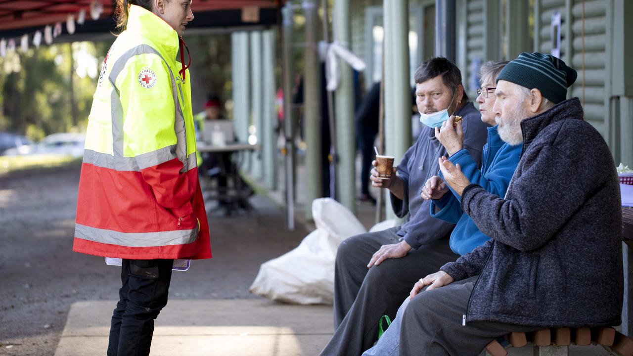 A Red Cross volunteer speaks to local residents at the Kalorama relief centre. Picture: Arsineh Houspian