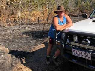 BURNT OUT: Barry Collins on his Boyne Valley property 'Bow River' after a recent bush fire