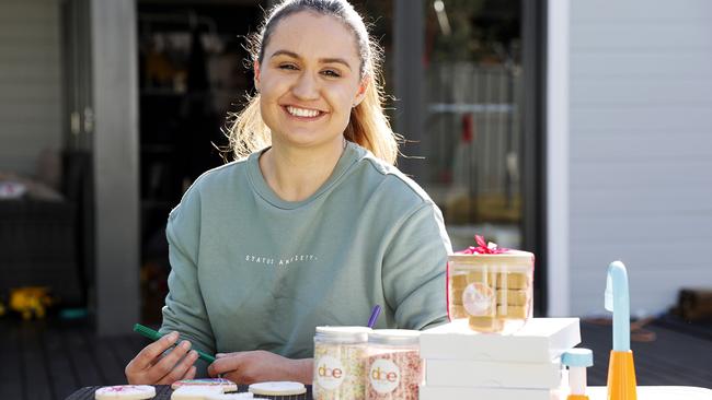 Caitie Baker with products from her business Bake and Decorate. Picture: Tim Hunter.