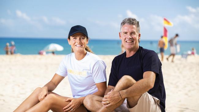 Surf Life Saving champion Jordan Mercer with dad and legend of the sport Darren Mercer on Noosa Main Beach. Picture: Lachie Millard