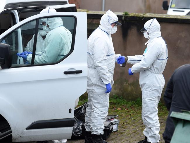 Police forensics officers work at the rear of a residential address in Stafford, raided in connection with the stabbings on London Bridge. Picture: AFP