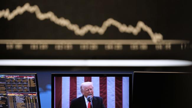 Donald Trump appears on a television screen at the stock market in Frankfurt, Germany on April 3. Picture: AP /Michael Probst