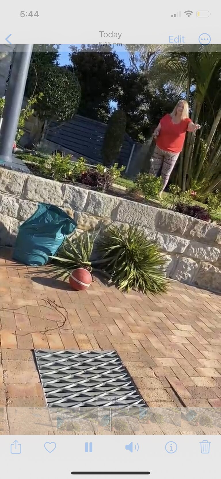 Ms Barter hosing her garden in the video during the basketball confrontation. Picture: Supplied