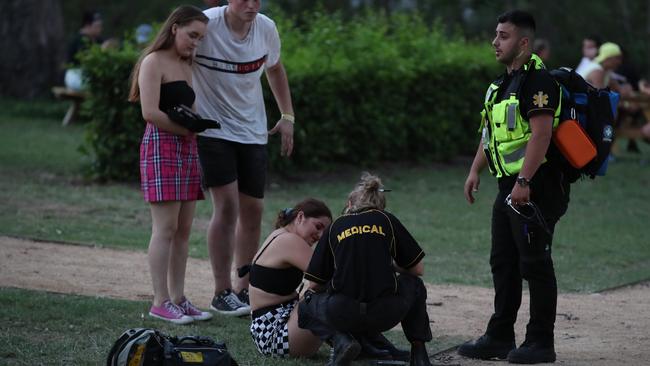 Medics attend to a reveller at FOMO music festival. Picture: David Swift