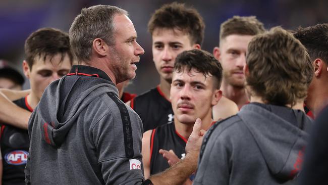 PERTH, AUSTRALIA – JUNE 24: Ben Rutten, Senior Coach of the Bombers coach addresses the team at three quarter time break during the 2022 AFL Round 15 match between the West Coast Eagles and the Essendon Bombers at Optus Stadium on June 24, 2022 in Perth, Australia. (Photo by Will Russell/AFL Photos via Getty Images)