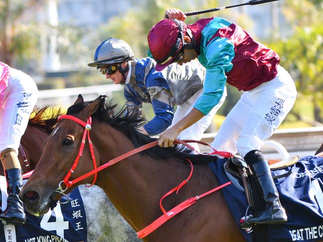 Jockey Joao Moreira rides Beat The Clock of Hong Kong to victory from Jockey Karis Teetan riding Hot King Prawn of Hong Kong and Jockey Zac Purton riding Aethero of Hong Kong in race 5, the The Longines Hong Kong Sprint, during the Hong Kong international races at Sha Tin, Sunday, December 8, 2019. (AAP Image/ Vince Caligiuri) NO ARCHIVING, EDITORIAL USE ONLY