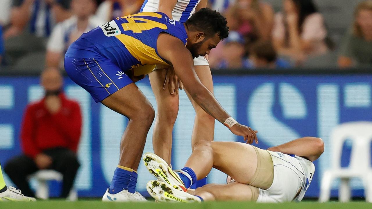 Willie Rioli checks on Luke Davies-Uniacke after a bruising tackle. Picture: Michael Willson AFL Photos