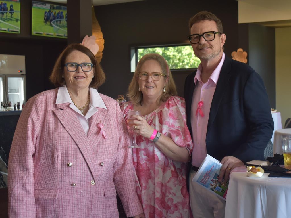 Sally Hillman, Margo Haks and Adrian Haks at the Rockhampton Jockey Club's Pink Ribbon Stradbroke Charity Race Day at Callaghan Park on June 15, 2024.