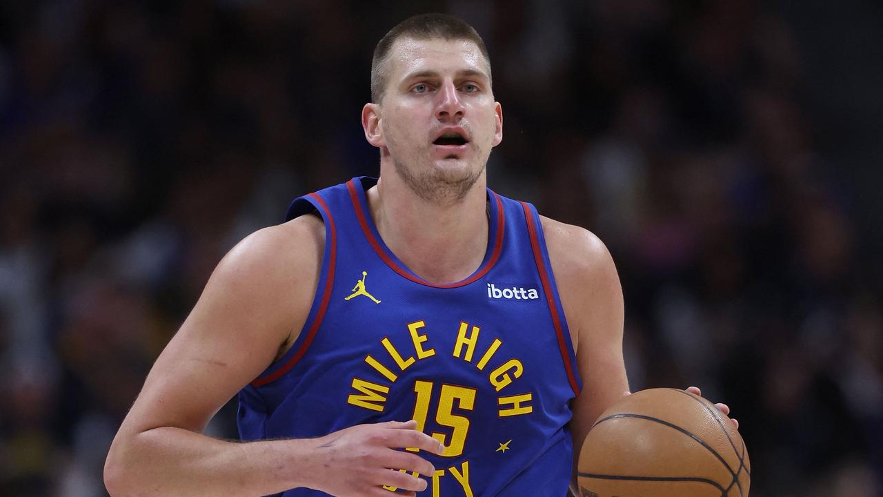 (FILES) Nikola Jokic #15 of the Denver Nuggets brings the ball down the court against the Minnesota Timberwolves in the first quarter during Game One of the Western Conference Second Round Playoffs at Ball Arena on May 04, 2024 in Denver, Colorado. Denver Nuggets center Nikola Jokic was named NBA Most valuable Player for the third time in four seasons on May 8, 2024. The 29-year-old Serbian star, who won the award in 2021 and 2022, finished runner-up in the voting in 2023 but had the satisfaction of leading the Nuggets to a first NBA title. (Photo by MATTHEW STOCKMAN / GETTY IMAGES NORTH AMERICA / AFP)