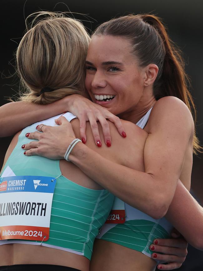 Claudia Hollingsworth (L) is hugged by Imogen Barrett of Australia after winning the women's 800 metre final.