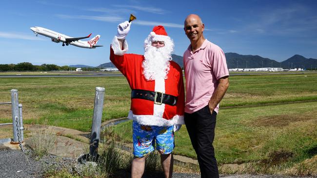 The Cairns Airport will support five Far North Queensland charities this festive season, donating a total of $25,000 to local not-for-profit organisations. Cairns Airport CEO Richard Barker celebrates the announcement of five donations of $5000 each with Santa (airport emergency manager Rob Keegan) at the Airport. Picture: Brendan Radke