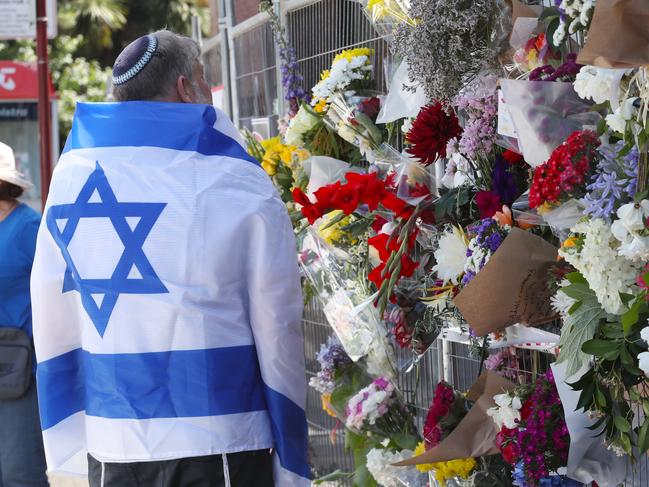 Floral tributes are left at the Adass Israel Synagogue in Ripponlea. Picture: David Crosling