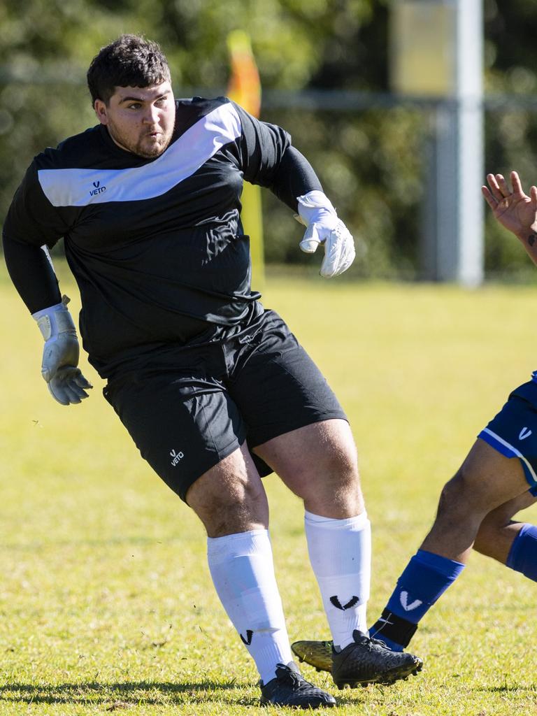 Chinchilla Bears keeper Coby Calleja clears the ball under pressure from Rockville Rovers player Tahssin Al Qaso in Div 1 Men FQ Darling Downs Presidents Cup football at West Wanderers, Sunday, July 24, 2022. Picture: Kevin Farmer