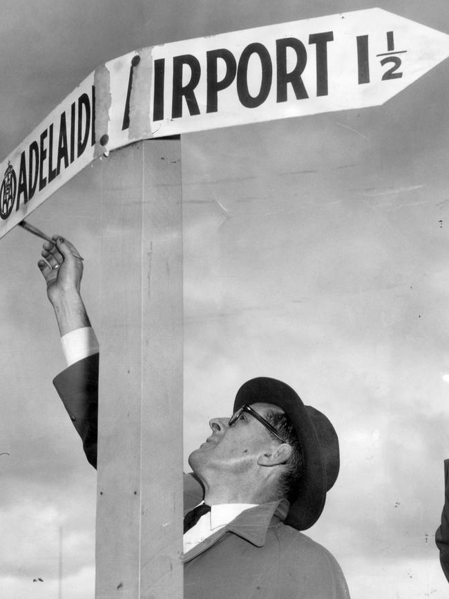 1958: Fingerprint expert Mr. H.E. Harrison dusts a street sign in Brooklyn Park, Adelaide, searching in vain for fingerprints after it was damaged by vandals.