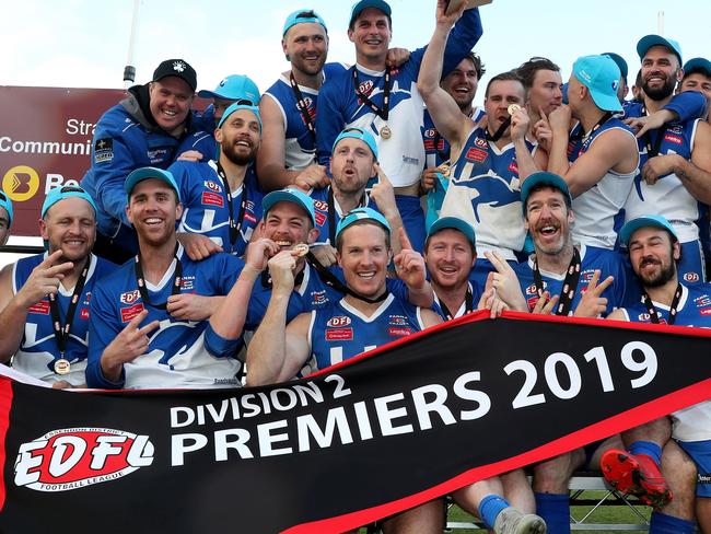 The Kangaroos celebrate with the premiership cup during the EDFL Div 2 grand final between Sunbury Kangaroos and Moonee Valley at Windy Hill Essendon on Saturday 7th September, 2019.