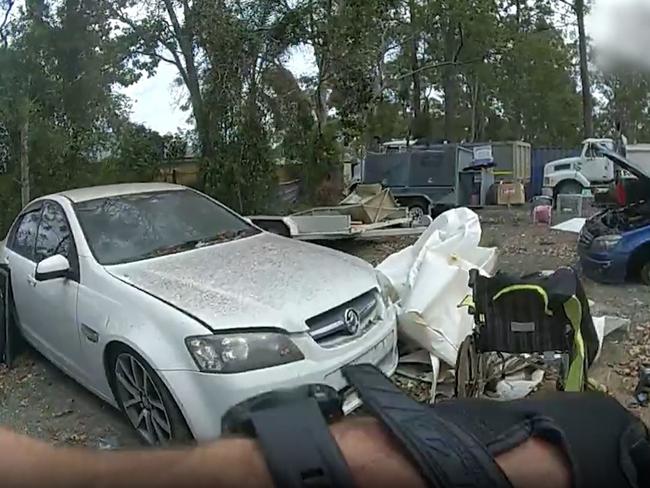 Stolen vehicles and firearms recovered by Queensland Police in Pallara. Photo: Queensland Police