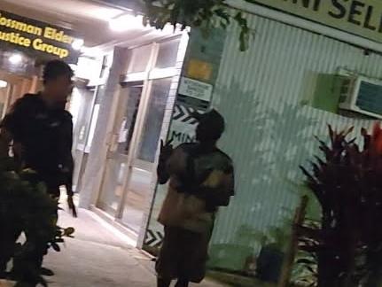 Police confront a group in Mossman after being alerted by a a citizen's night patrol. Picture: Supplied