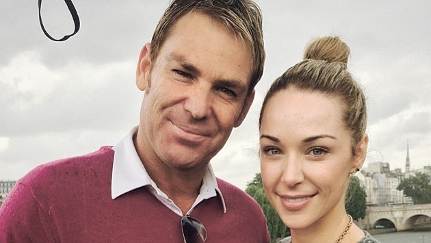 Model and DJ Emily Scott in Paris with Shane Warne. Picture: Instagram