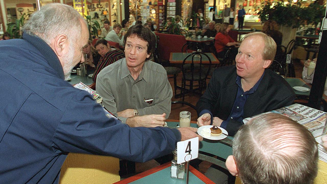 Mr Morley served dishing up dessert to “media tart” former Qld premier Peter Beattie. File picture