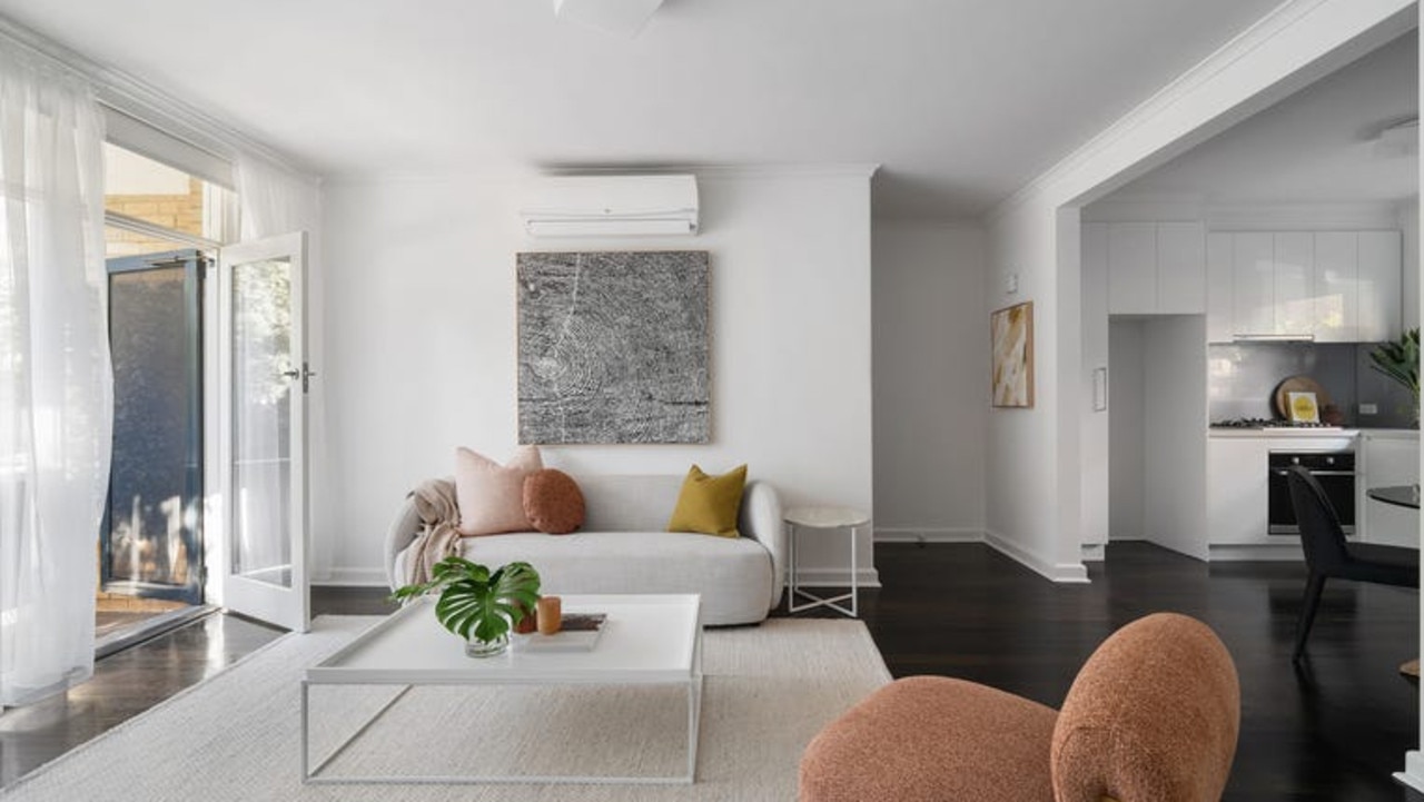 The living and dining area opens to a balcony.
