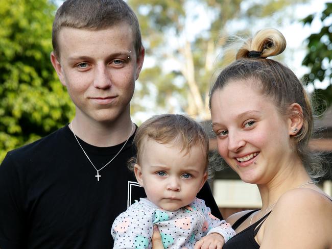 Brendan Nelson, 18, with his pregnant girlfriend Cheyanne Cameron-Eastment, 16, and their daughter Brenda, 1. Cheyanne is pregnant again. Picture: Jonathan Ng