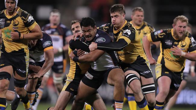 Brumbies prop Scott Sio tussles with the Western Force defence. Both teams, who have been mentioned as victims of a culling process, should survive