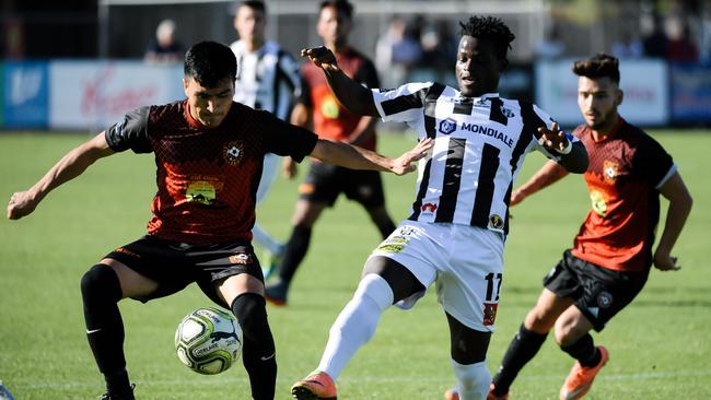 Hussain Askari and Mamadi Kamara during Ghan Kilburn City’s FFA Cup clash with SA soccer powerhouse Adelaide City last year. Picture: AAP/Morgan Sette